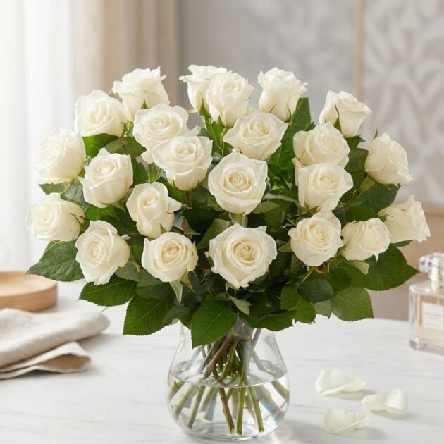 Hand-crafted 18 white rose bouquet wrapped in premium paper for an elegant floral gift.