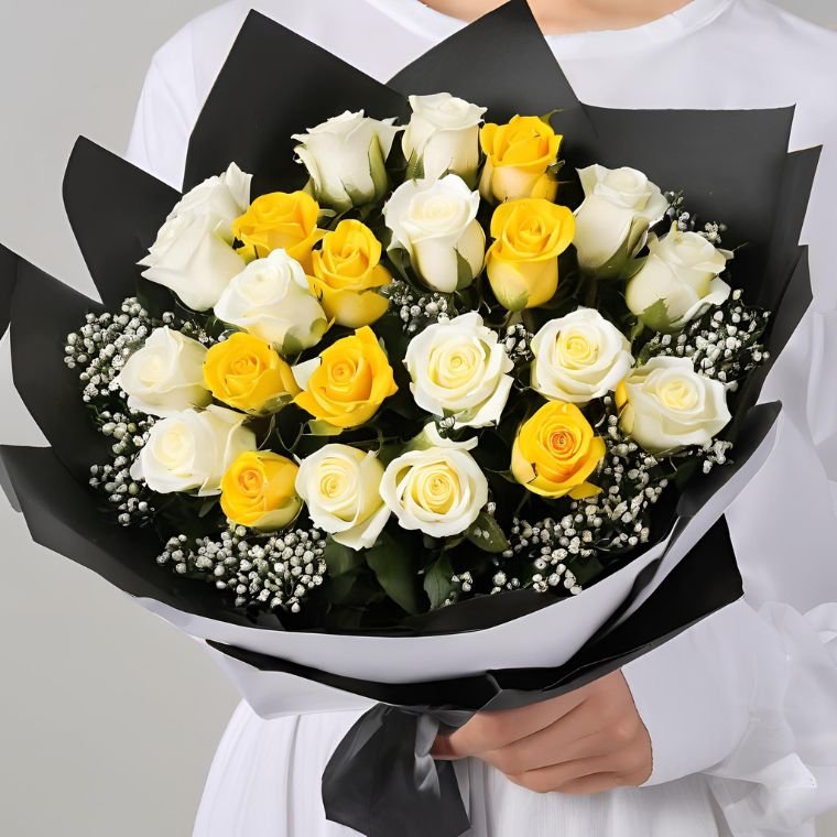 Radiant Yellow & White Roses 1 A beautiful yellow and white rose bouquet arranged with fresh green leaves in a stylish wrap.